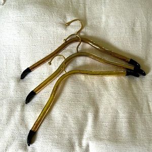 Beautiful black and gold burnished metal coat hangars